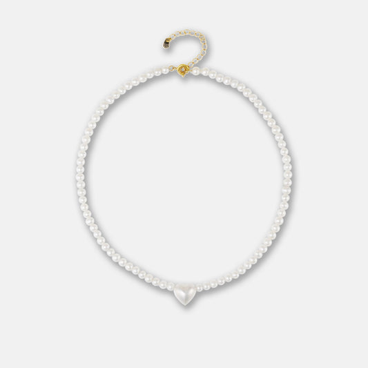 Elegant white pearl necklace with heart charm, perfect for adding a touch of romance to any outfit.