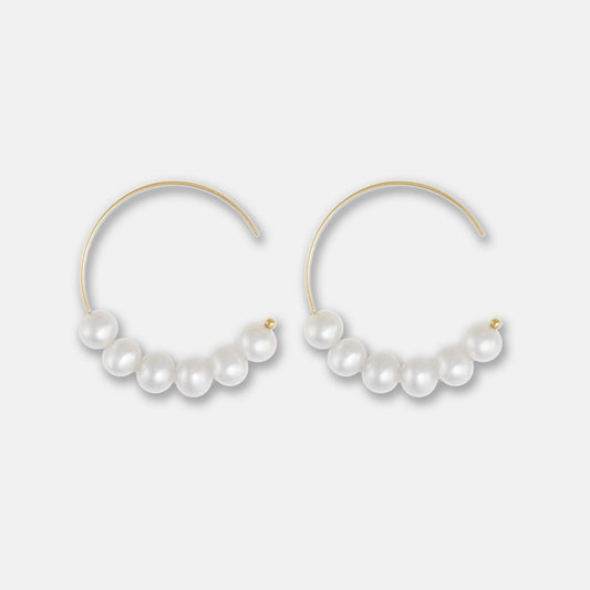 Exquisite gold pearl hoop earrings, adorned with lustrous pearls, offer a touch of elegance and sophistication. Perfect for any occasion.