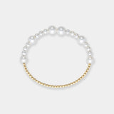 Stunning bracelet featuring white freshwater pearls and luxurious 18k yellow gold beads, a timeless accessory.