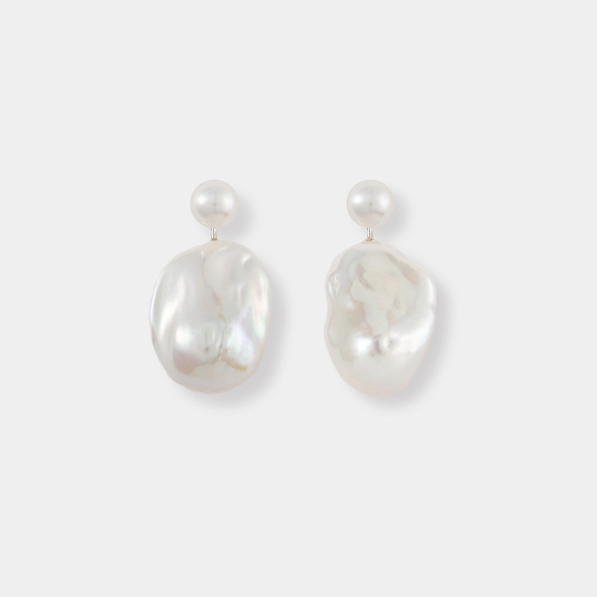 Stylish Baroque Pearl Charm Piercing earrings featuring beautiful white pearls, a must-have accessory.