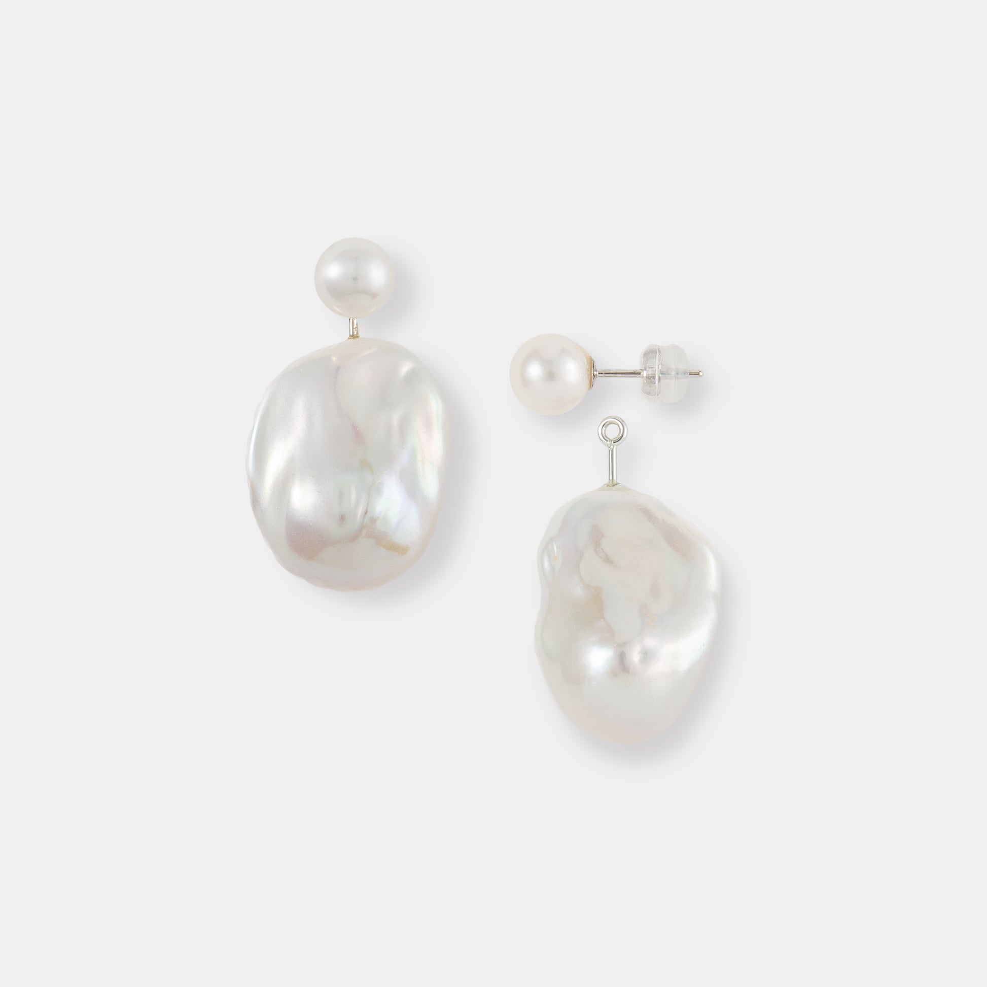 Enhance your look with these stunning Baroque Pearl Charm Piercing earrings, showcasing lustrous white pearls.