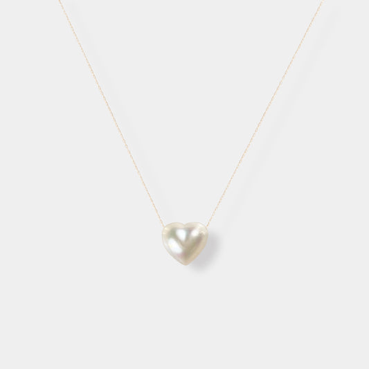 Enhance your elegance with our exquisite Heart Pearl Chain Necklace - a stunning white pearl heart pendant on a delicate gold chain.