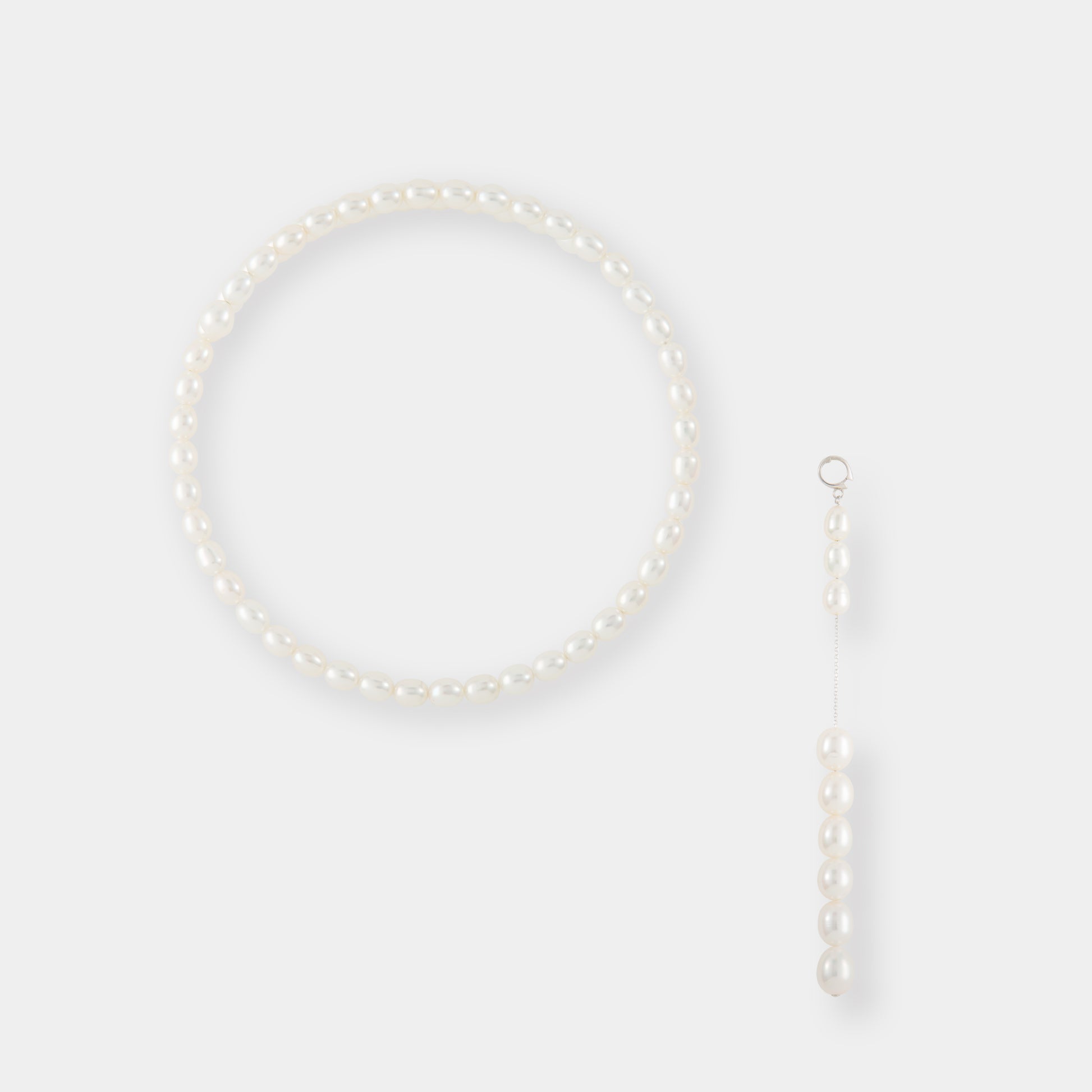 Indulge in sophistication with our pearl necklace, boasting a chain and a mesmerizing pearl drop. Experience the allure of our Oval Pearl Charm Choker.
