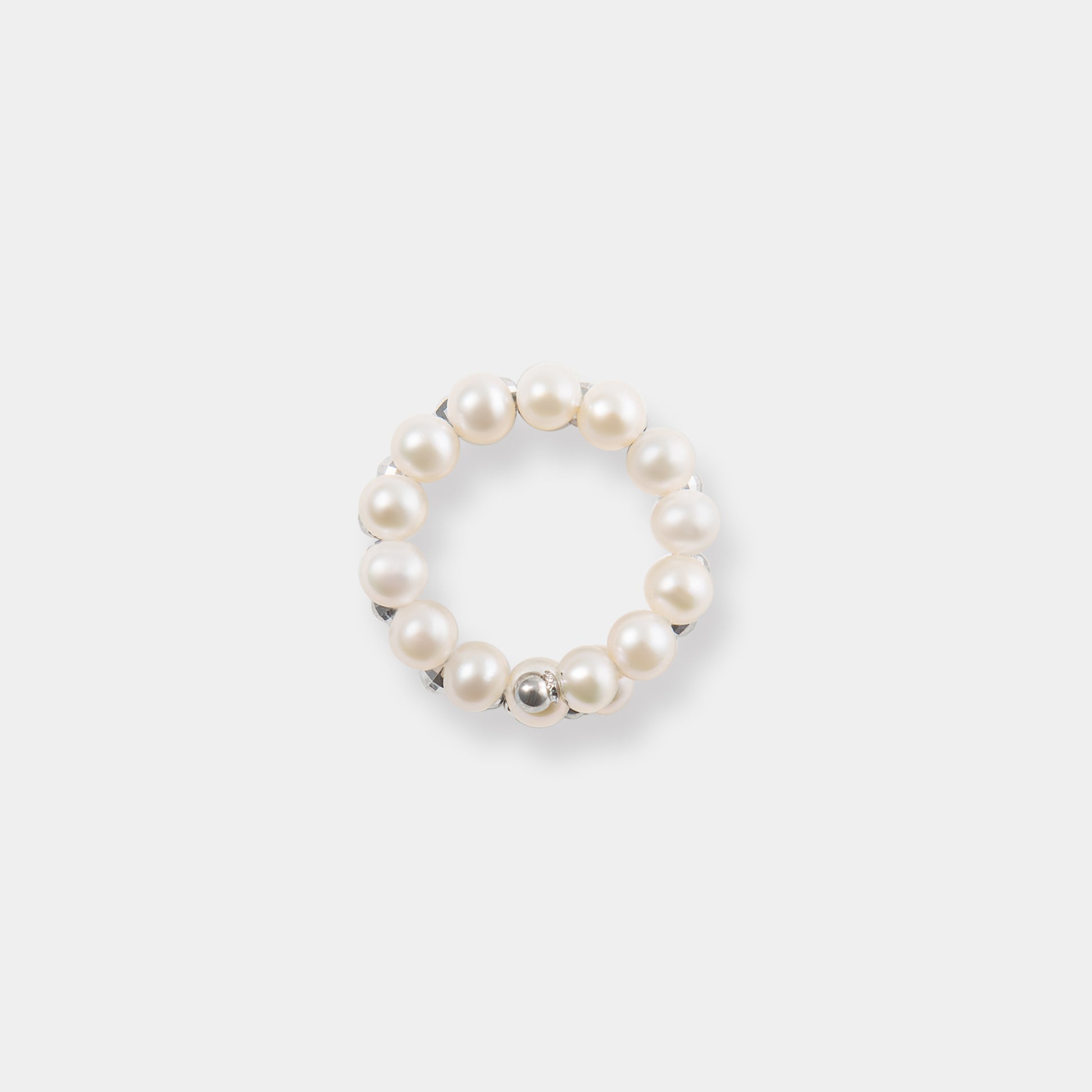Elevate your look with our stunning Spiral Pearl x White Gold Ring, a timeless accessory that exudes grace and beauty.