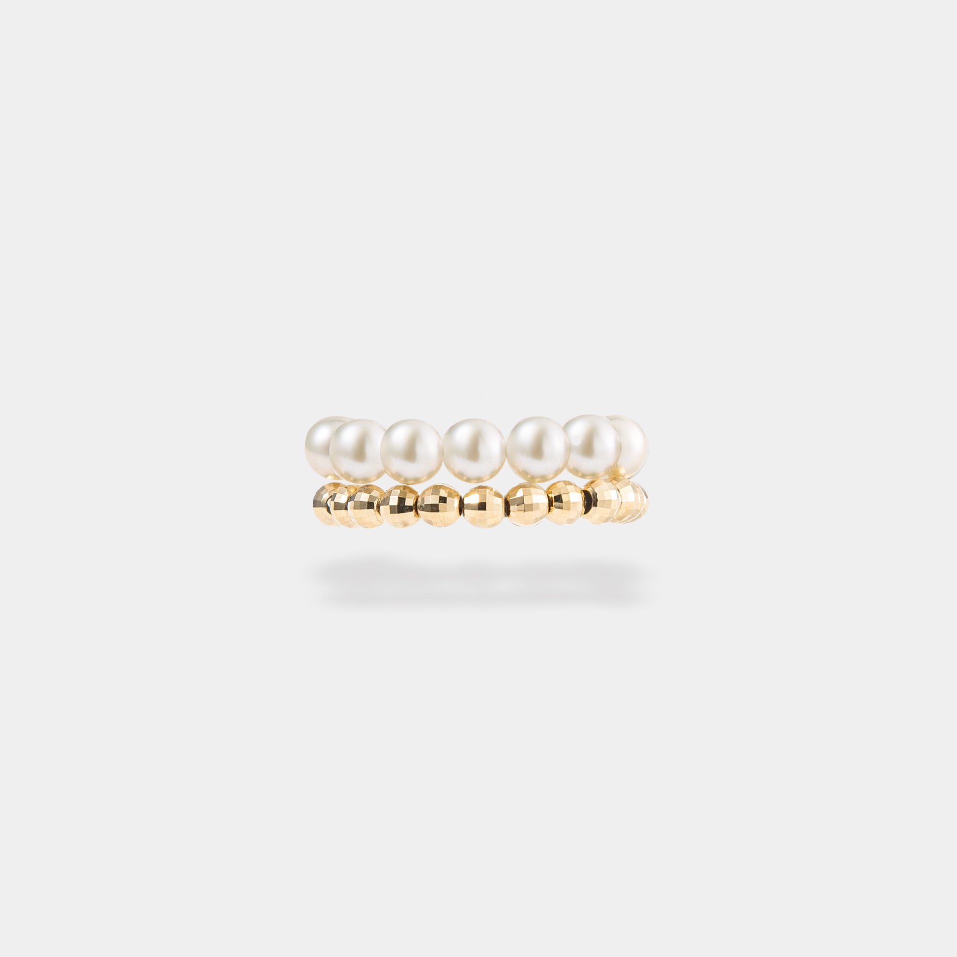 Stunning spiral pearl x gold ring, a luxurious accessory that exudes timeless beauty and elegance.
