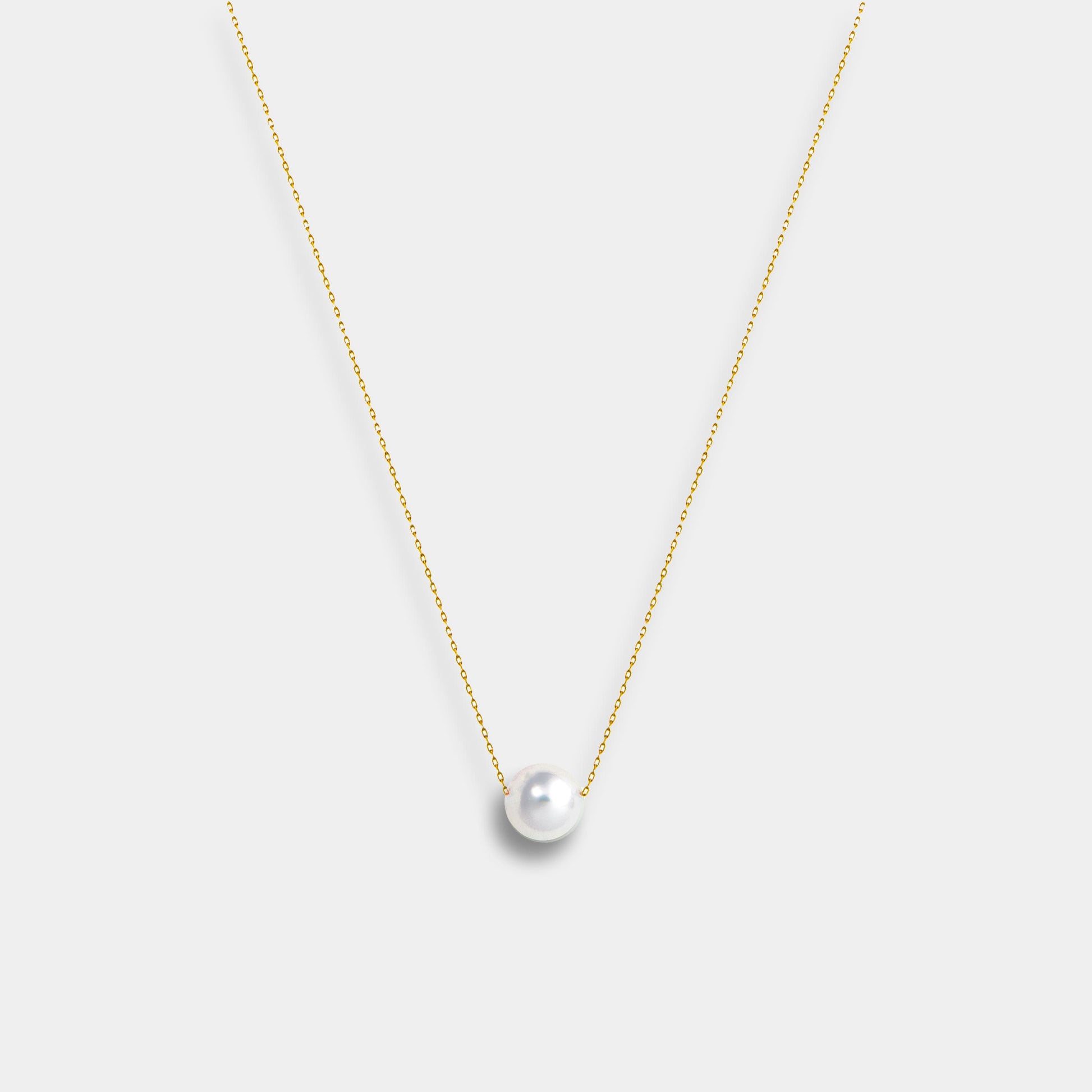 Enhance your elegance with a Floating Akoya Necklace, featuring a gold chain and a stunning pearl pendant.