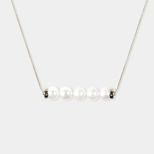 Enhance your elegance with a Parallel Pearl Necklace - a stunning white pearl necklace with a gold plated chain. Perfect for any occasion!
