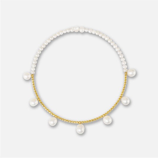 Enhance your elegance with a stunning Pearl Dot x Gold Choker, featuring a pearl necklace adorned with gold beads and pearls.
