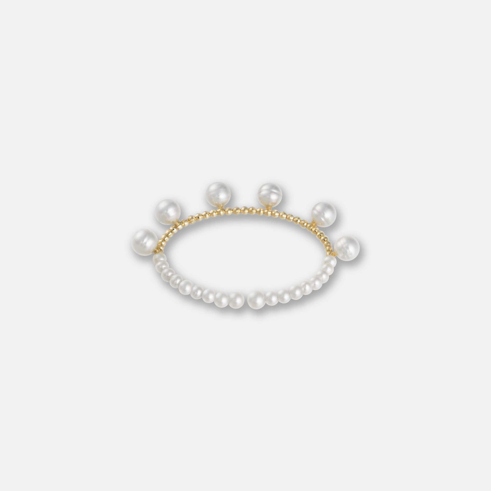 Stunning pearl bracelet featuring gold beads against a white backdrop. A timeless piece that exudes luxury and style.