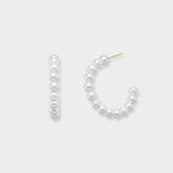 Elegant pearl hoop earrings, meticulously adorned with a continuous row of radiant pearls forming a graceful C-shape. These versatile hoops offer a fresh take on classic pearls, perfect for everyday luxury or special occasions. Make them yours and shine brighter!