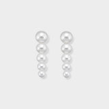Stunning pearl drop earrings featuring five perfectly graduated pearls, designed to elegantly elongate your look. Elevate any outfit with these timeless and luxurious earrings. Shop now for classic elegance!