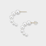 Versatile pearl half-hoop earrings, featuring a delicate row of pearls in a charming C-shape, designed for comfort and captivating style. These stunning earrings are the perfect accessory to elevate your daily elegance. Treat yourself to the timeless beauty of pearls!