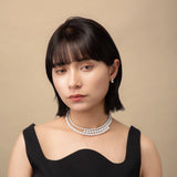 Infinity Necklace worn with a black top