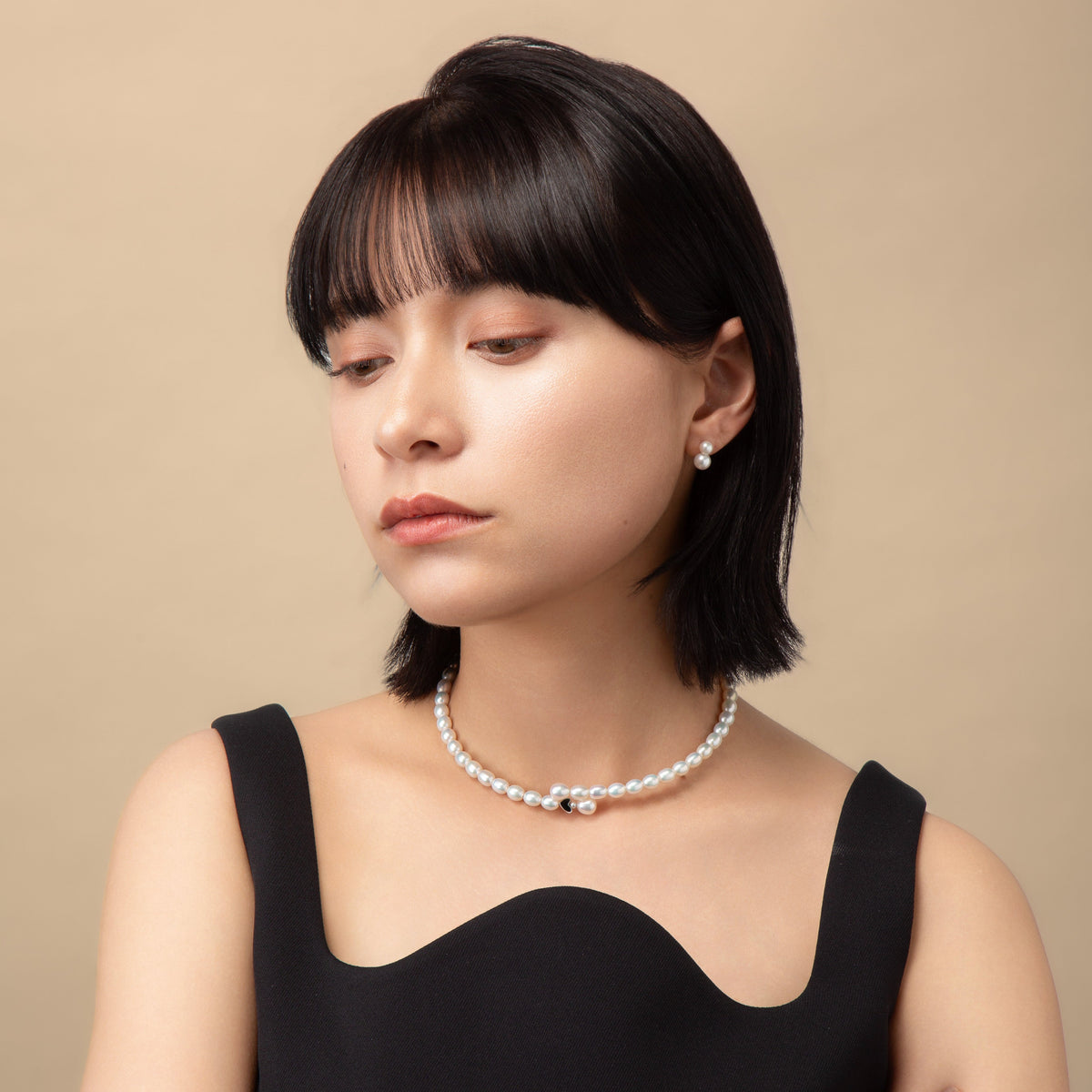 Black Enamel Pearl Choker worn with a black top