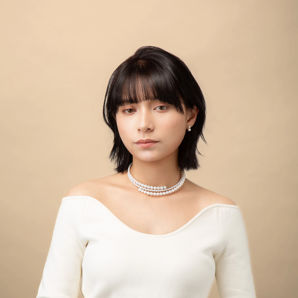 Infinity Necklace worn with a white top