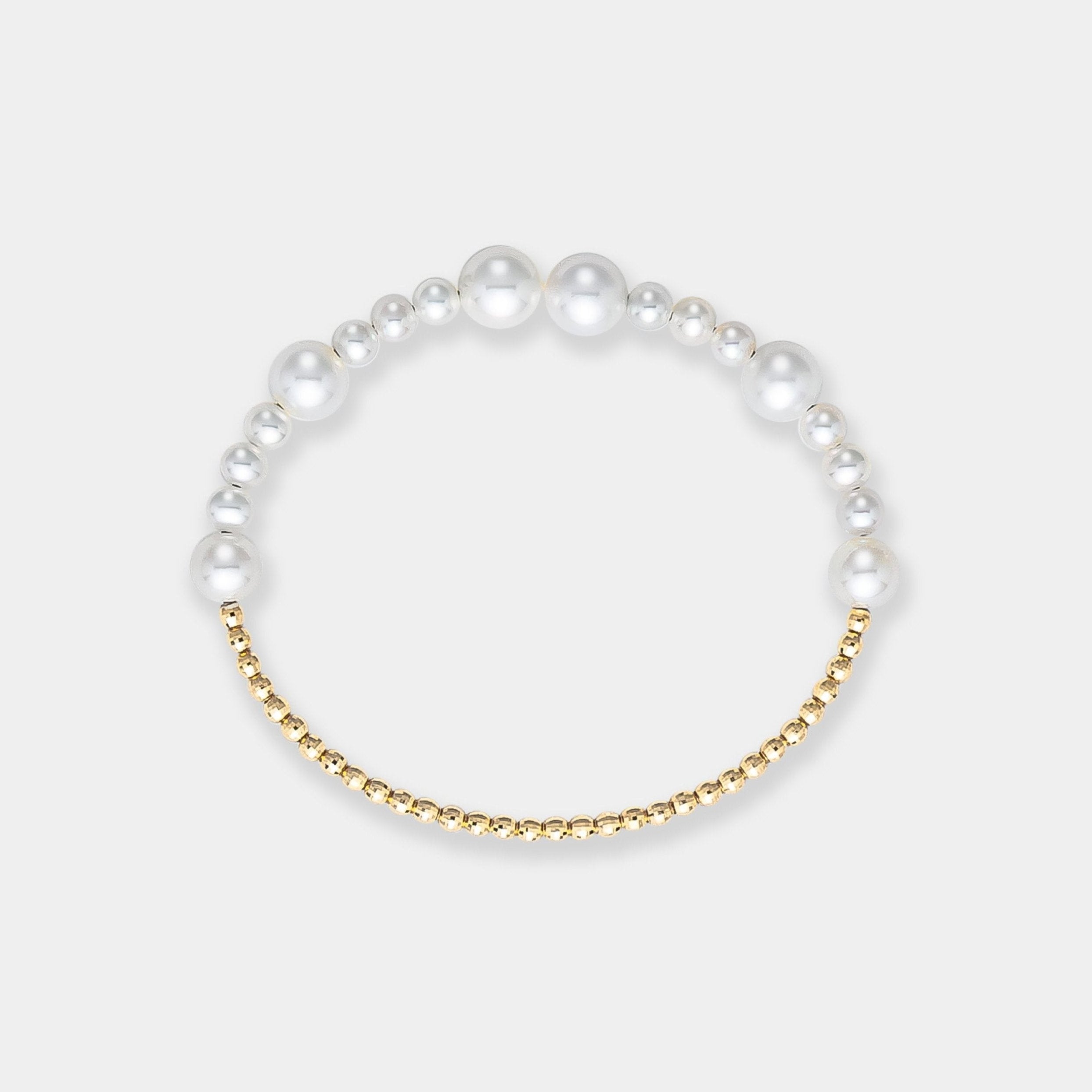 Stunning bracelet featuring white freshwater pearls and luxurious 18k yellow gold beads, a timeless accessory.