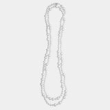 Elegant long freshwater pearl necklace with a silver clasp, a must-have piece for sophisticated elegance.