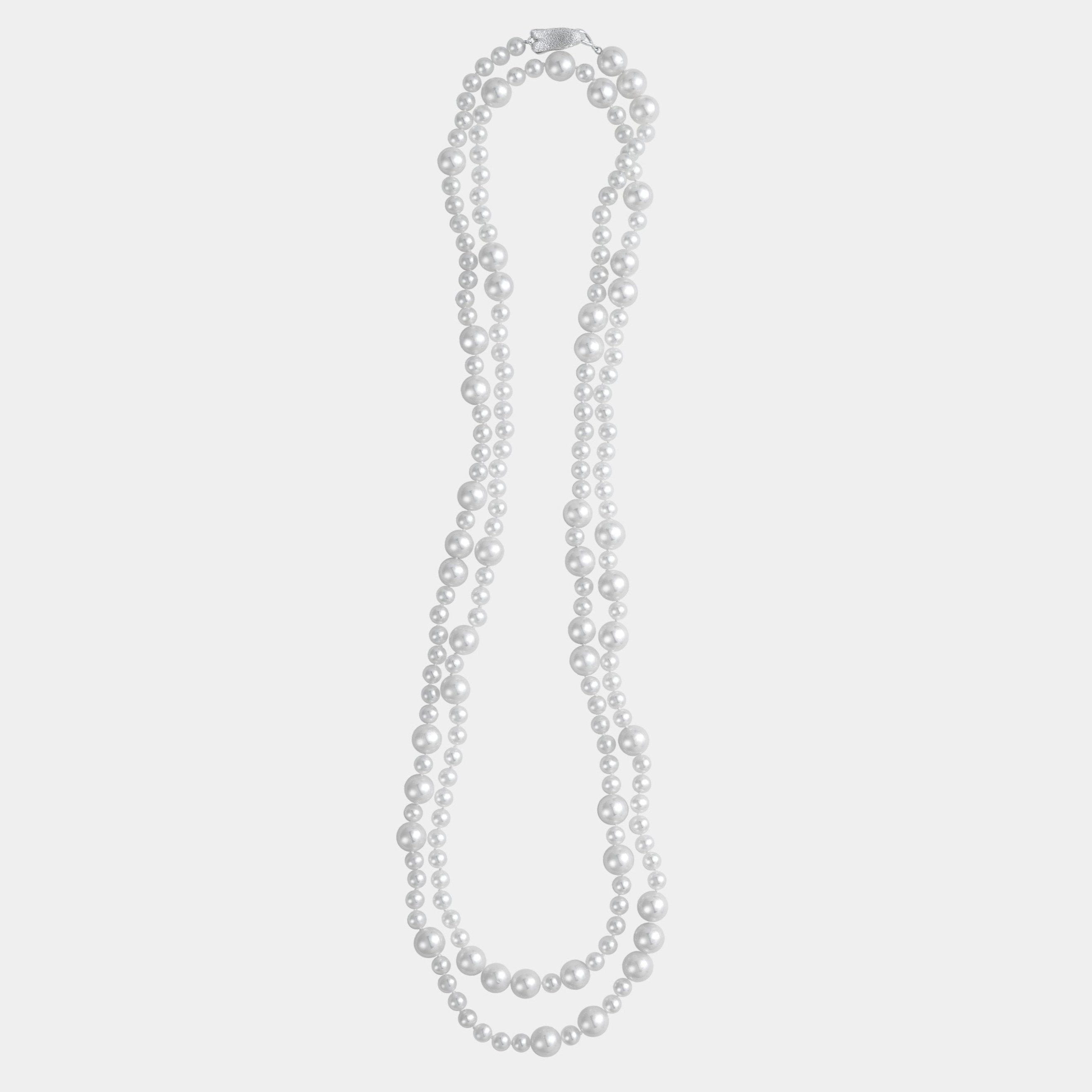 Elegant long freshwater pearl necklace with a silver clasp, a must-have piece for sophisticated elegance.
