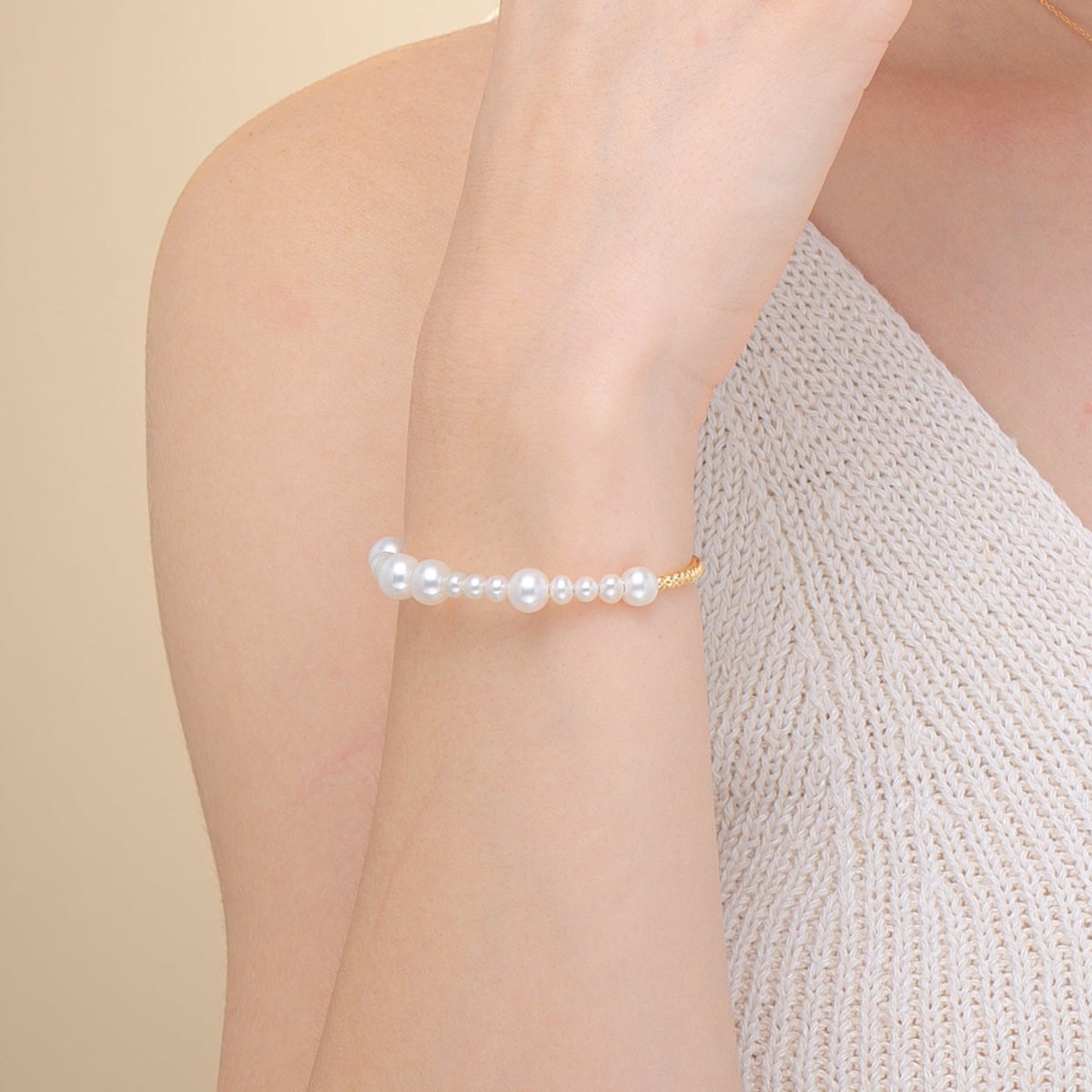 Fancy Pearl Gold Bracelet worn on the wrist