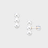 Elevate your look with our Triple Pearl Pierce. Featuring a modern vertical design with three graduated freshwater pearls, these studs offer a chic, architectural twist on a classic favorite. Made in 18K Yellow Gold.