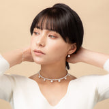 Discover effortless elegance with our Sway Pearl Pierce. A minimalist 18K yellow gold wire holds a radiant freshwater pearl pearl for a delicate, floating effect. Shop this timeless accessory.