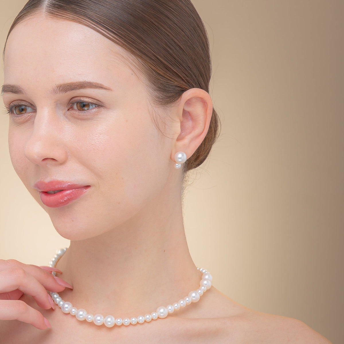 Fancy Pearl Pierce worn with a pearl necklace
