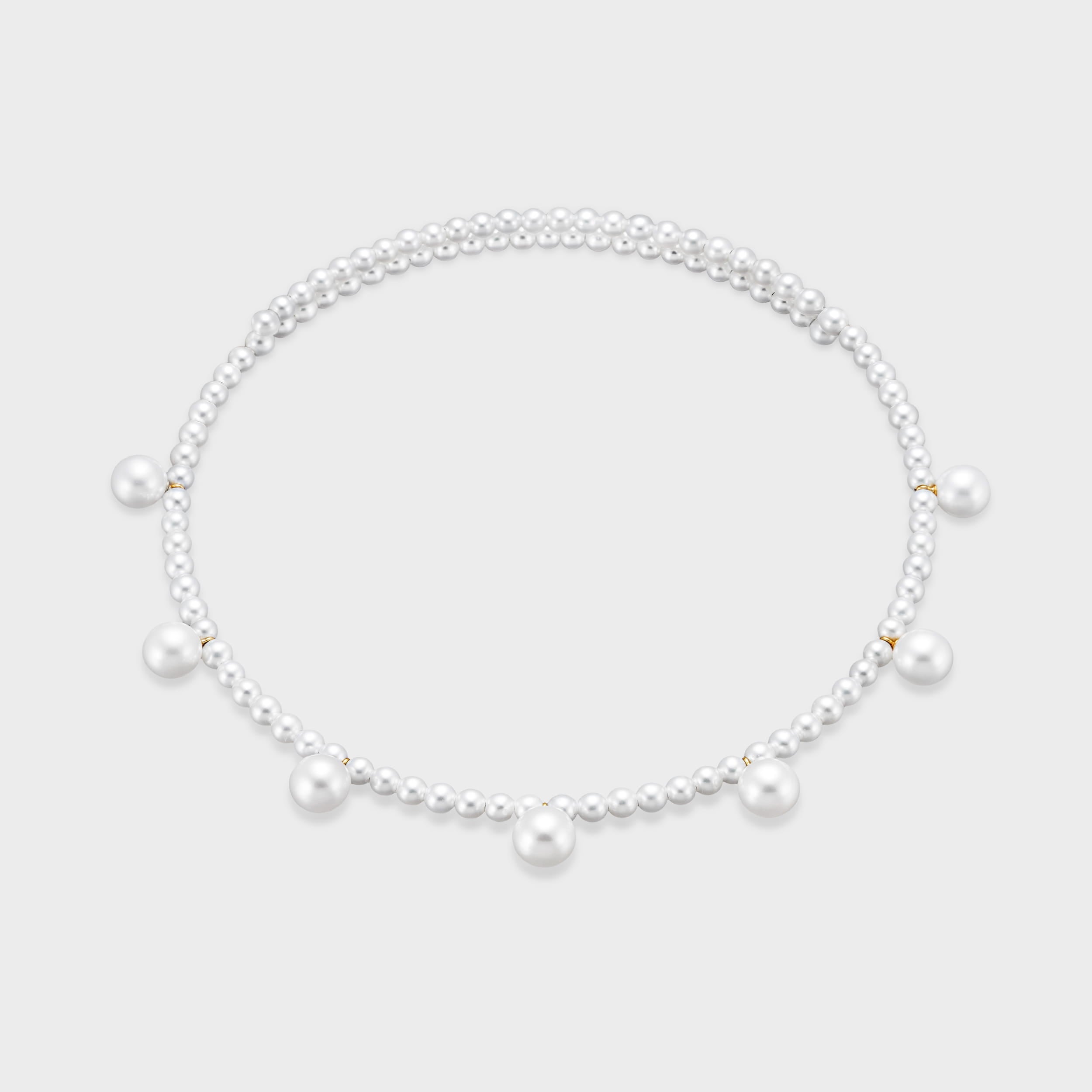 A playful twist on a classic. Our Pearl Dot Freshwater Choker features radiant larger freshwater pearls suspended from a delicate strand. Modern, feminine, and perfect for layering. Made in 18K yellow gold.