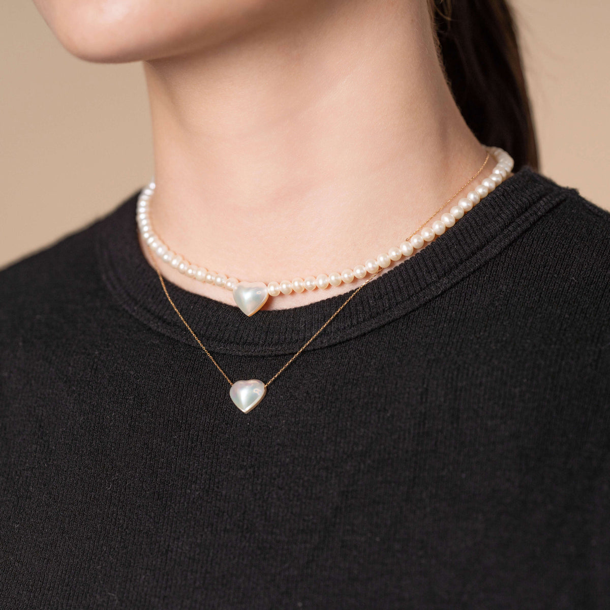 Heart Pearl Chain Necklace worn layered with a heart pearl strand