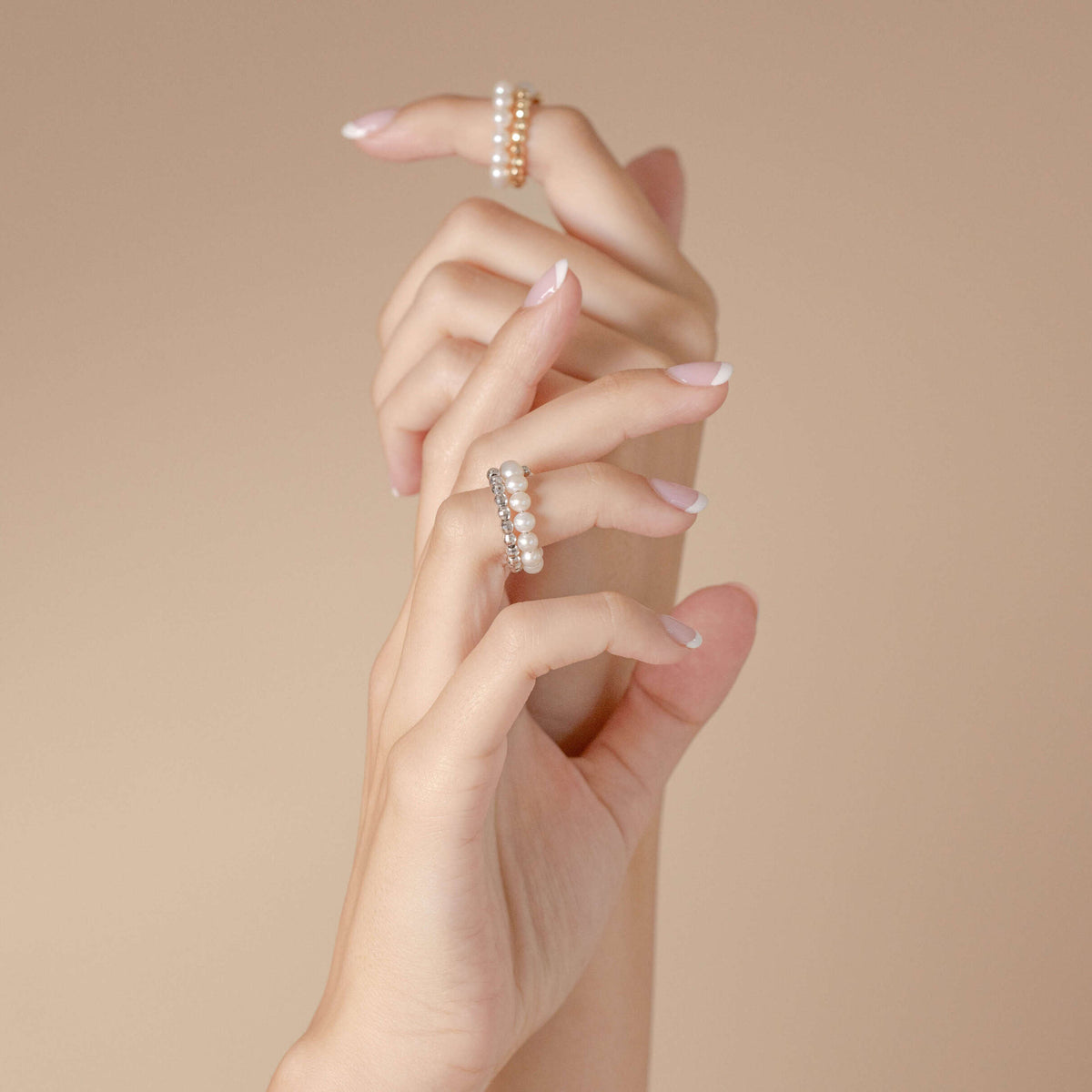 Spiral Pearl White Gold Ring worn on the fingers