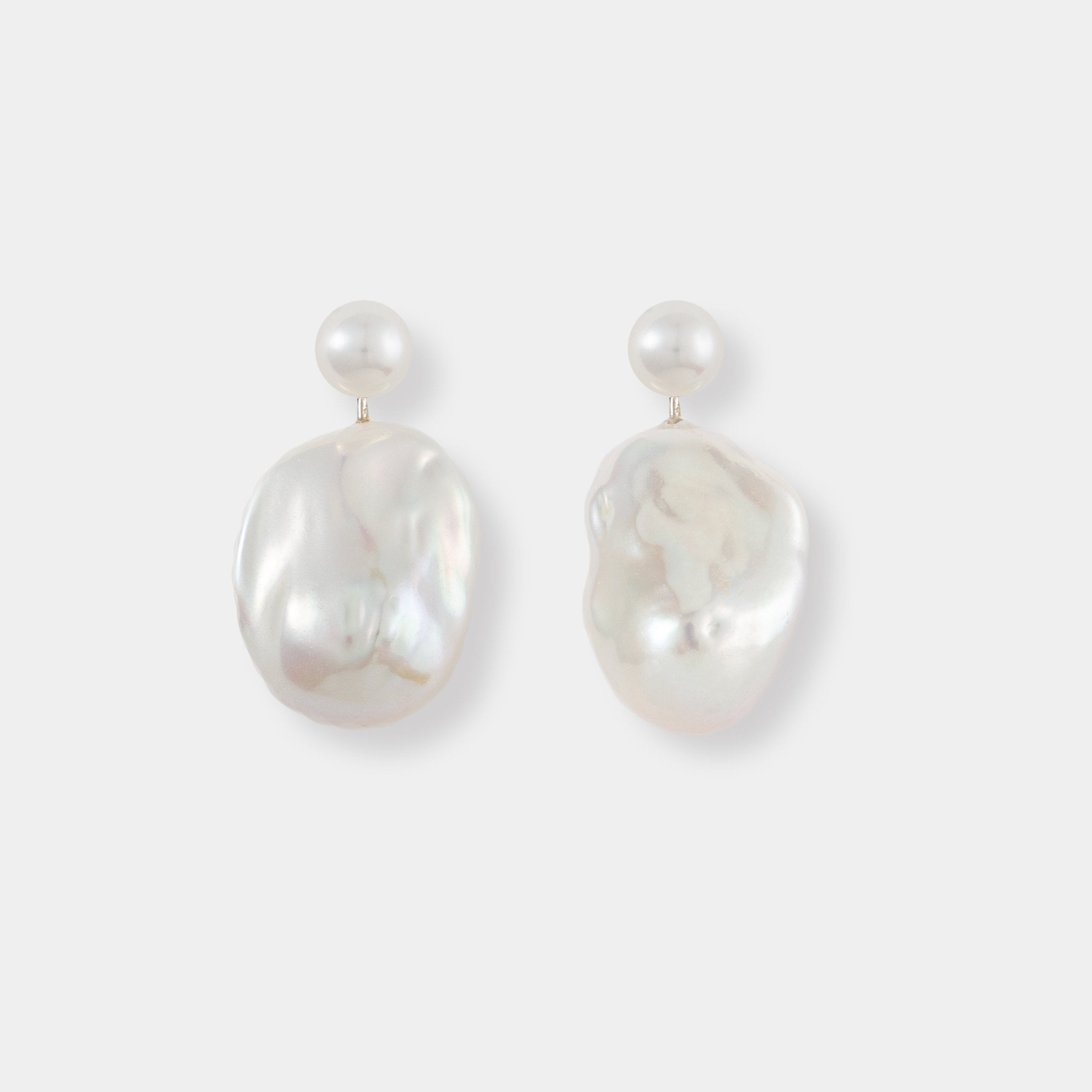 Stylish Baroque Pearl Charm Piercing earrings featuring beautiful white pearls, a must-have accessory.