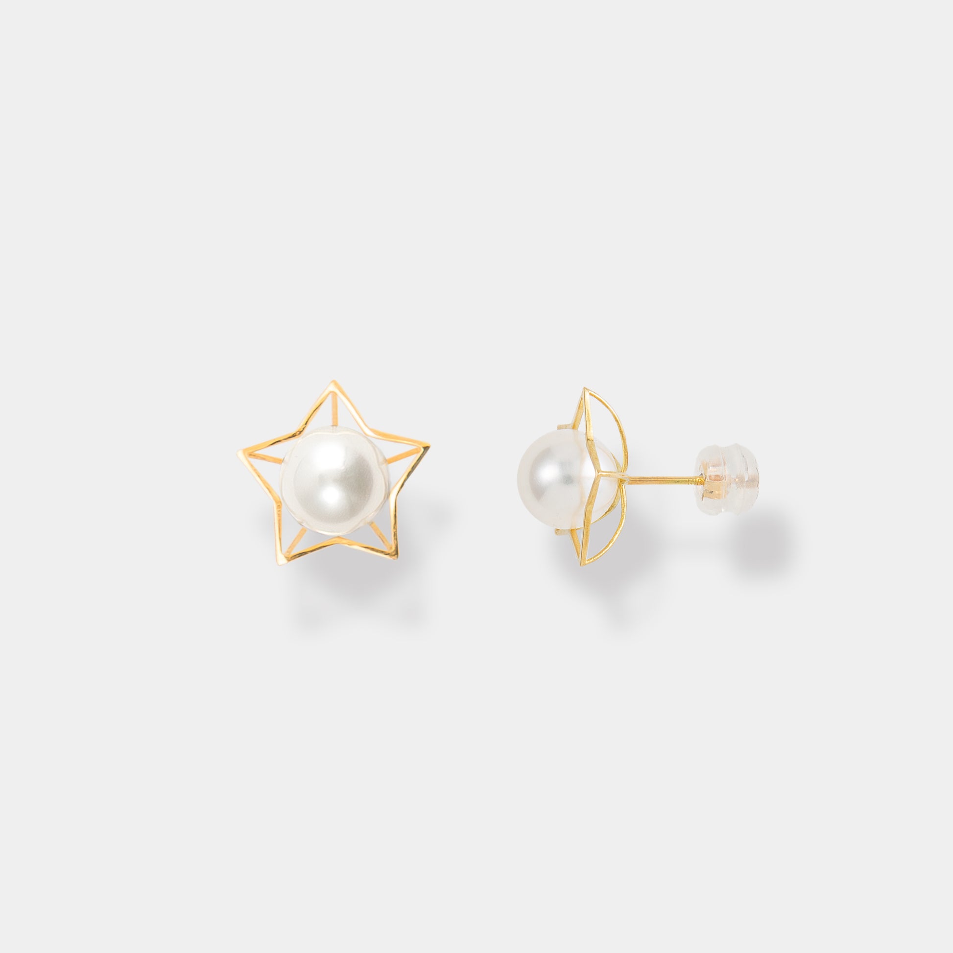 Elevate your style with these chic gold star stud earrings adorned with a classic pearl detail.