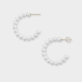 Stylish pearl semi-hoop earrings, encrusted with brilliant pearls that gracefully curve to frame your face. These elegant earrings are a must-have for adding a touch of sophistication to any look, from casual to formal. Adorn yourself with these beautiful pearl hoops today!
