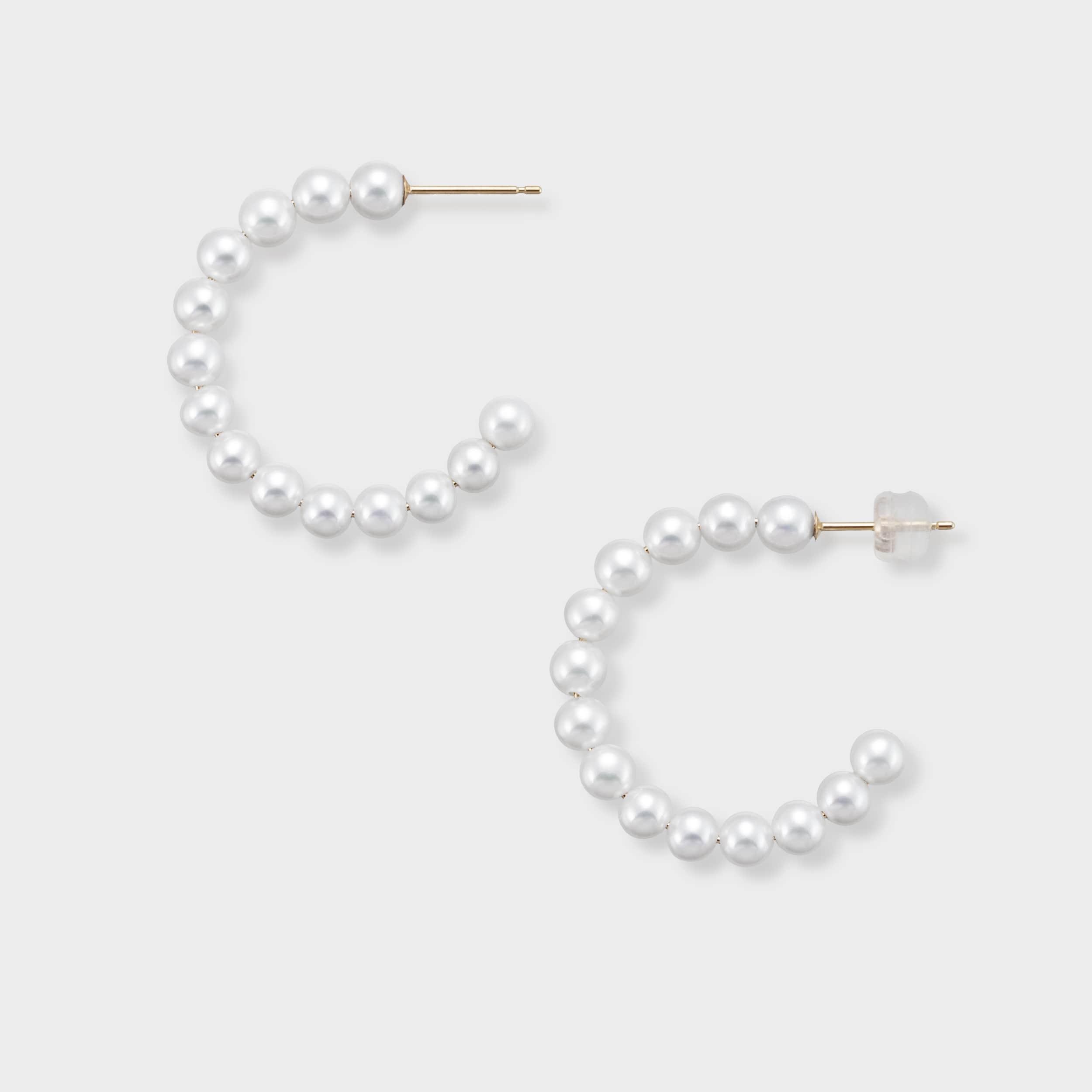 Stylish pearl semi-hoop earrings, encrusted with brilliant pearls that gracefully curve to frame your face. These elegant earrings are a must-have for adding a touch of sophistication to any look, from casual to formal. Adorn yourself with these beautiful pearl hoops today!