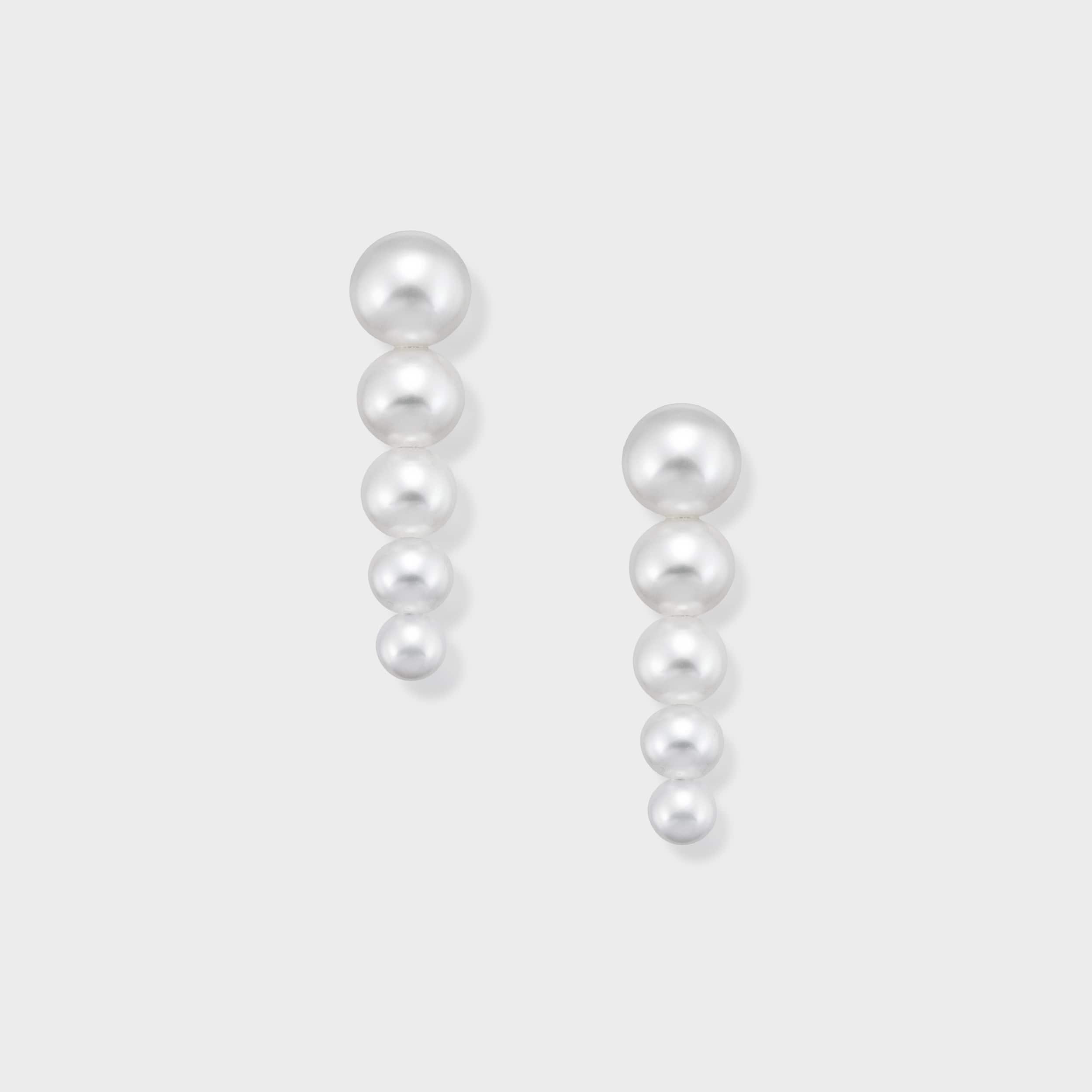 Exquisite pearl chandelier earrings, showcasing five descending pearls of increasing size for a truly captivating dangle. These elegant earrings are designed to add a touch of glamour and movement to your ensemble. Indulge in the luxury of pearls and make a statement. Purchase now!