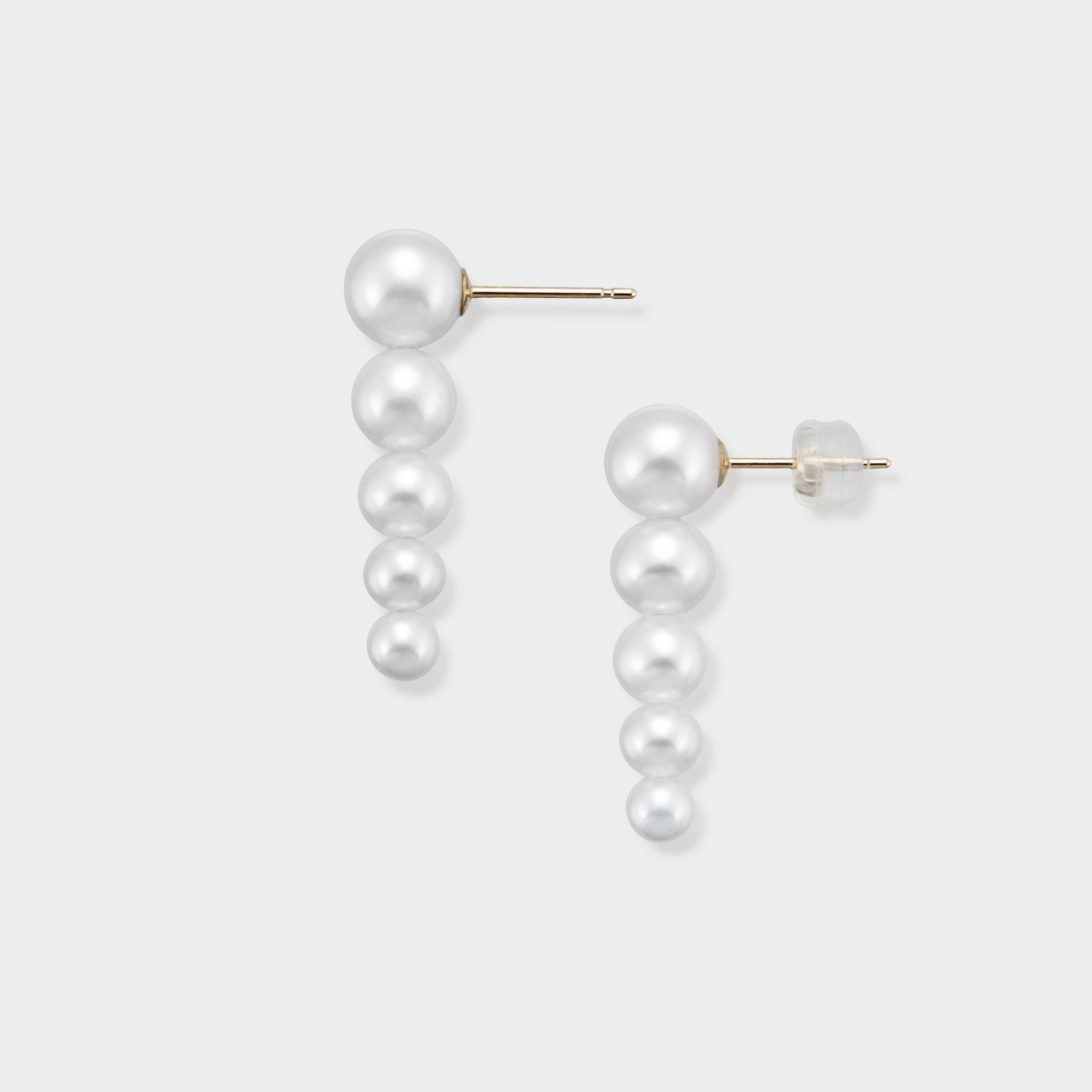Stunning pearl drop earrings featuring five perfectly graduated pearls, designed to elegantly elongate your look. Elevate any outfit with these timeless and luxurious earrings. Shop now for classic elegance!