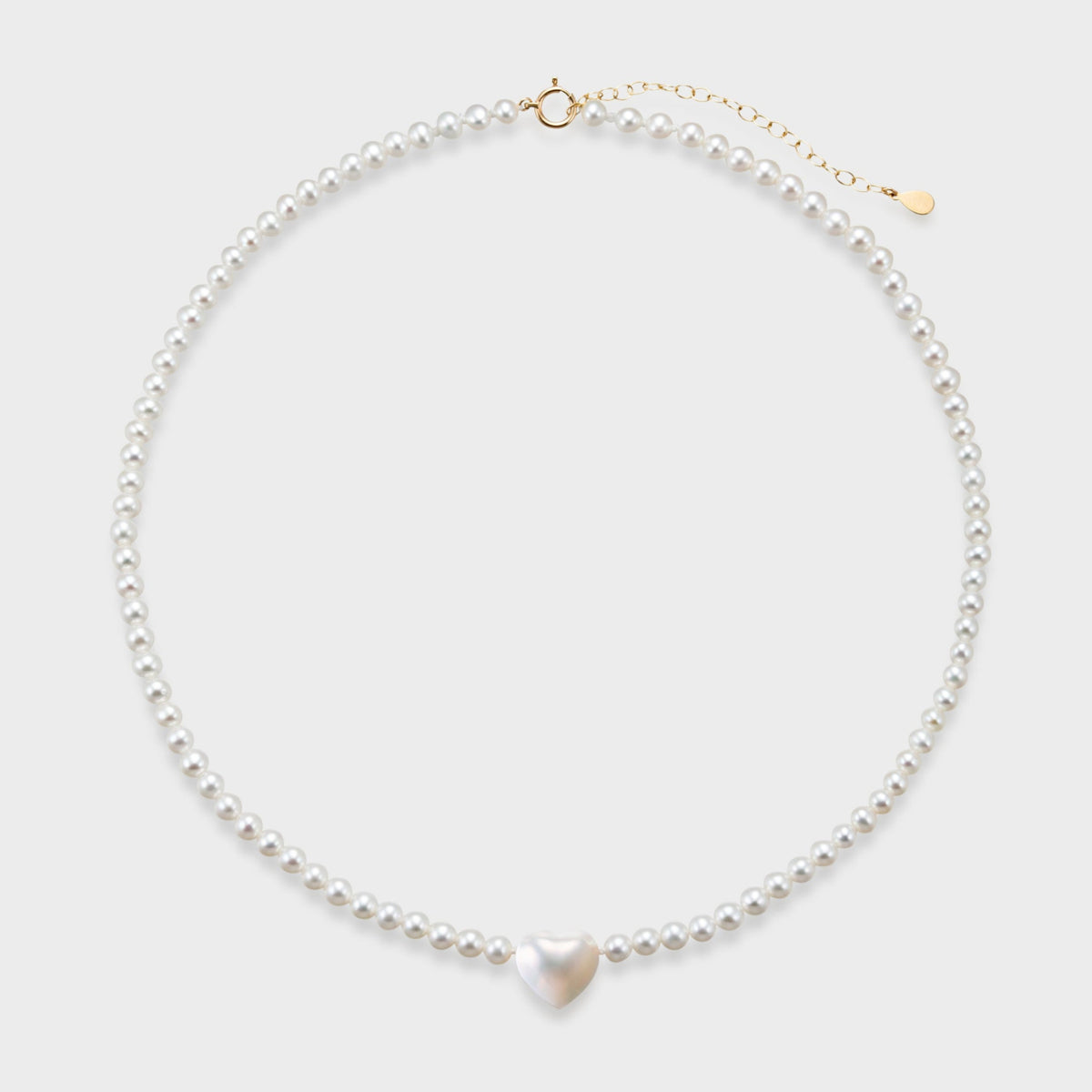 Heart Pearl Necklace: freshwater pearl strand with a Mabe heart pearl at the center