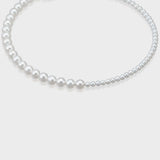A stunning white pearl choker, designed as a chic choker for a refined accessory look.