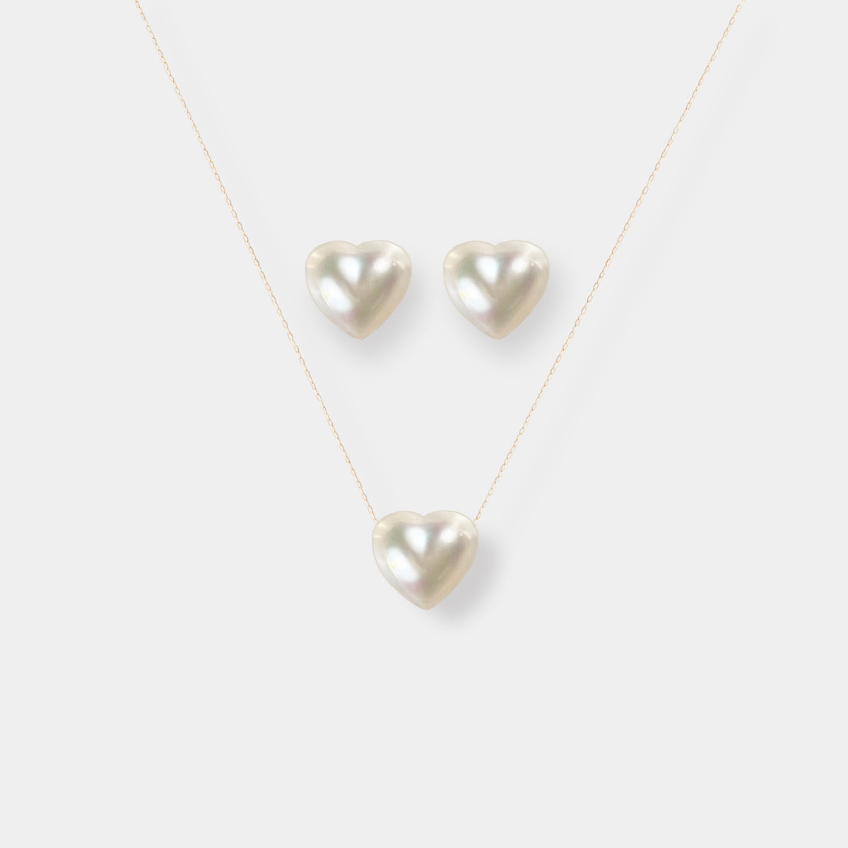 Heart Pearl Chain Necklace shown with the matching heart studs