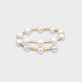 Double-layer gold and pearl bracelet featuring round white pearls and textured gold bar links.