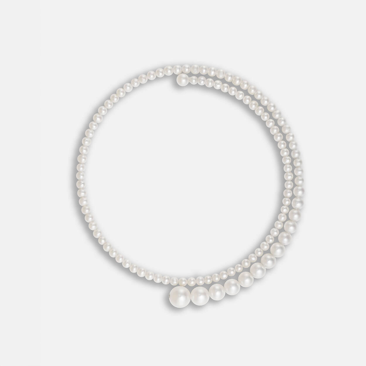 spiral necklace using white fresh water pearls, using 14K white gold.